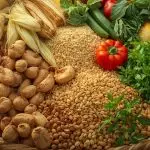 a basket full of sierra leone’s farm products cashew nuts, cassava, corn, rice, and vegetables, arranged beautifully, symbolizing food security and abundance.